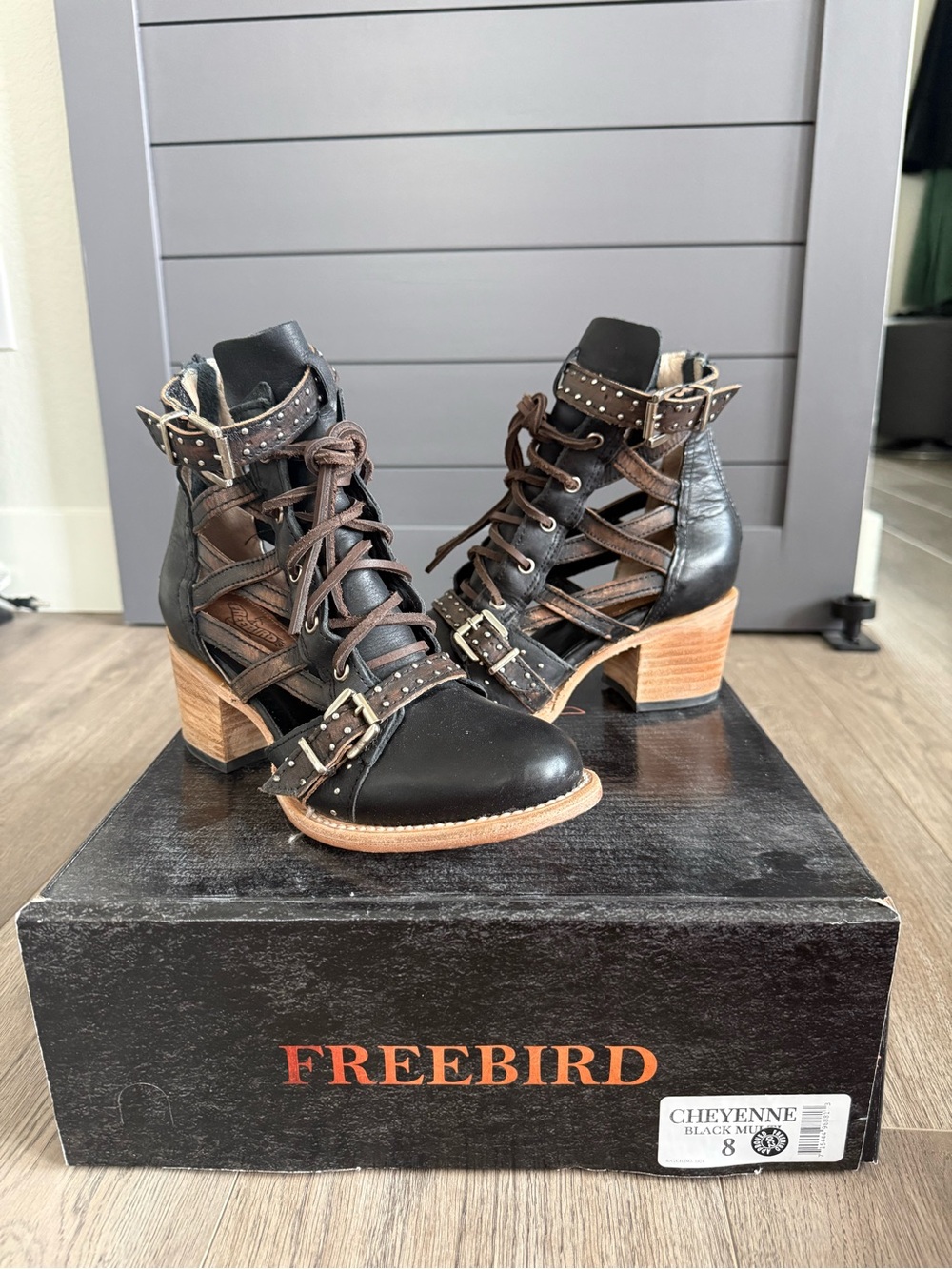 Freebird Black and Brown Lace-Up Cutout Booties with Studded Straps